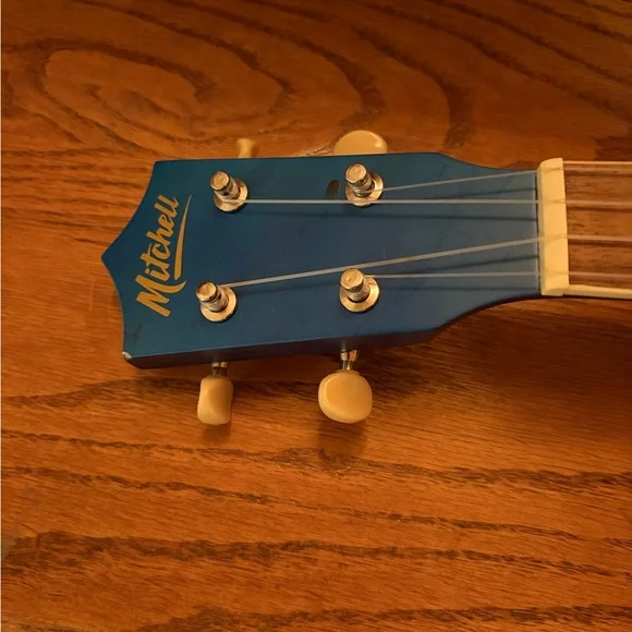 Blue Ukulele with Wooden Fretboard and case - Picture 5 of 13